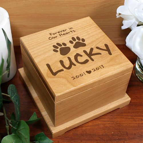 Wooden box engraved with 'Forever in Our Hearts Lucky 2001-2013' on a wooden surface.