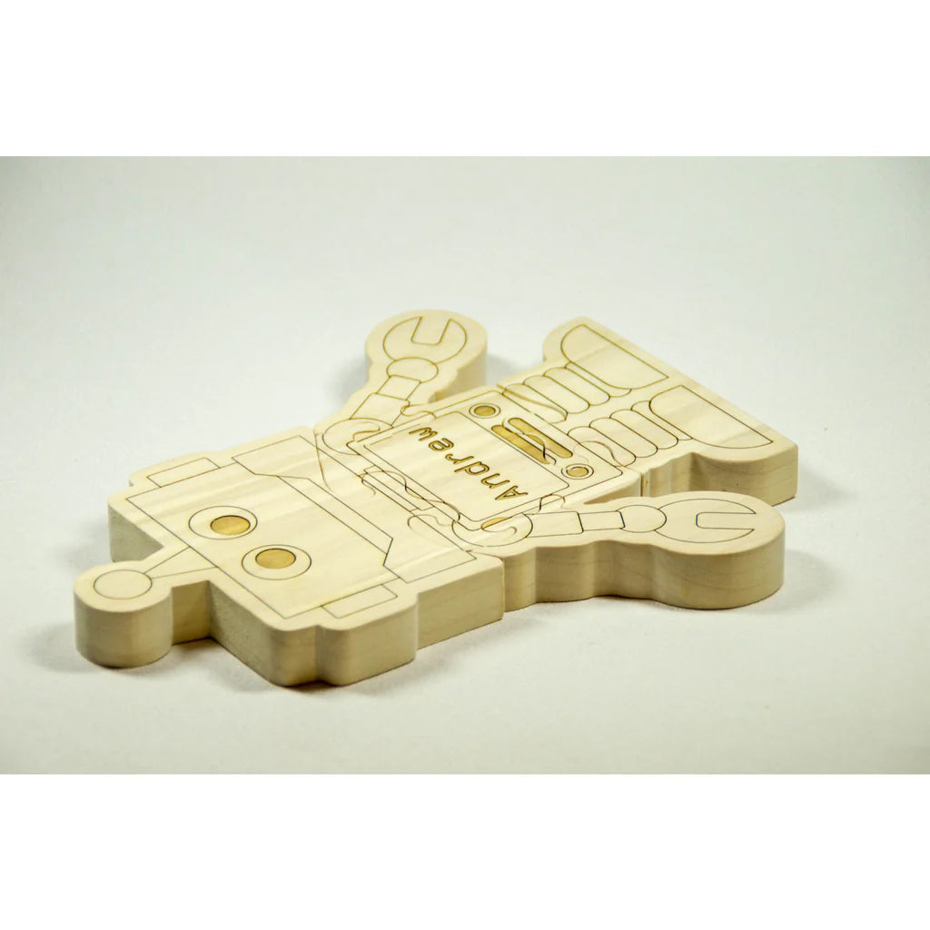 Wooden toy gun with 'Andeem' branding on a beige background